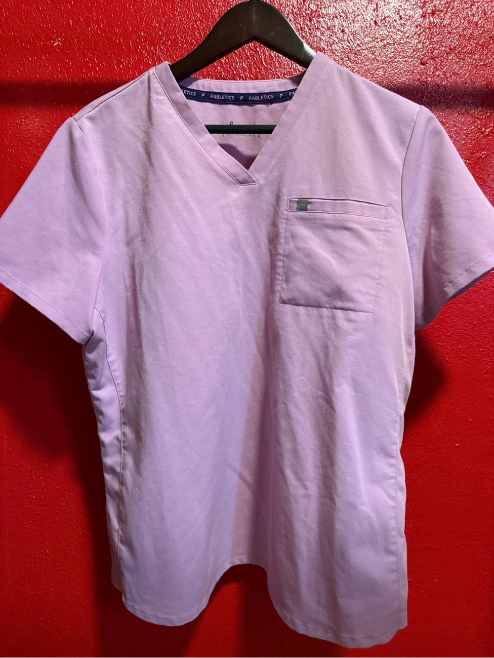 48. Preloved Fabletics Woman’s Light Lavender V-Neck Scrub Top